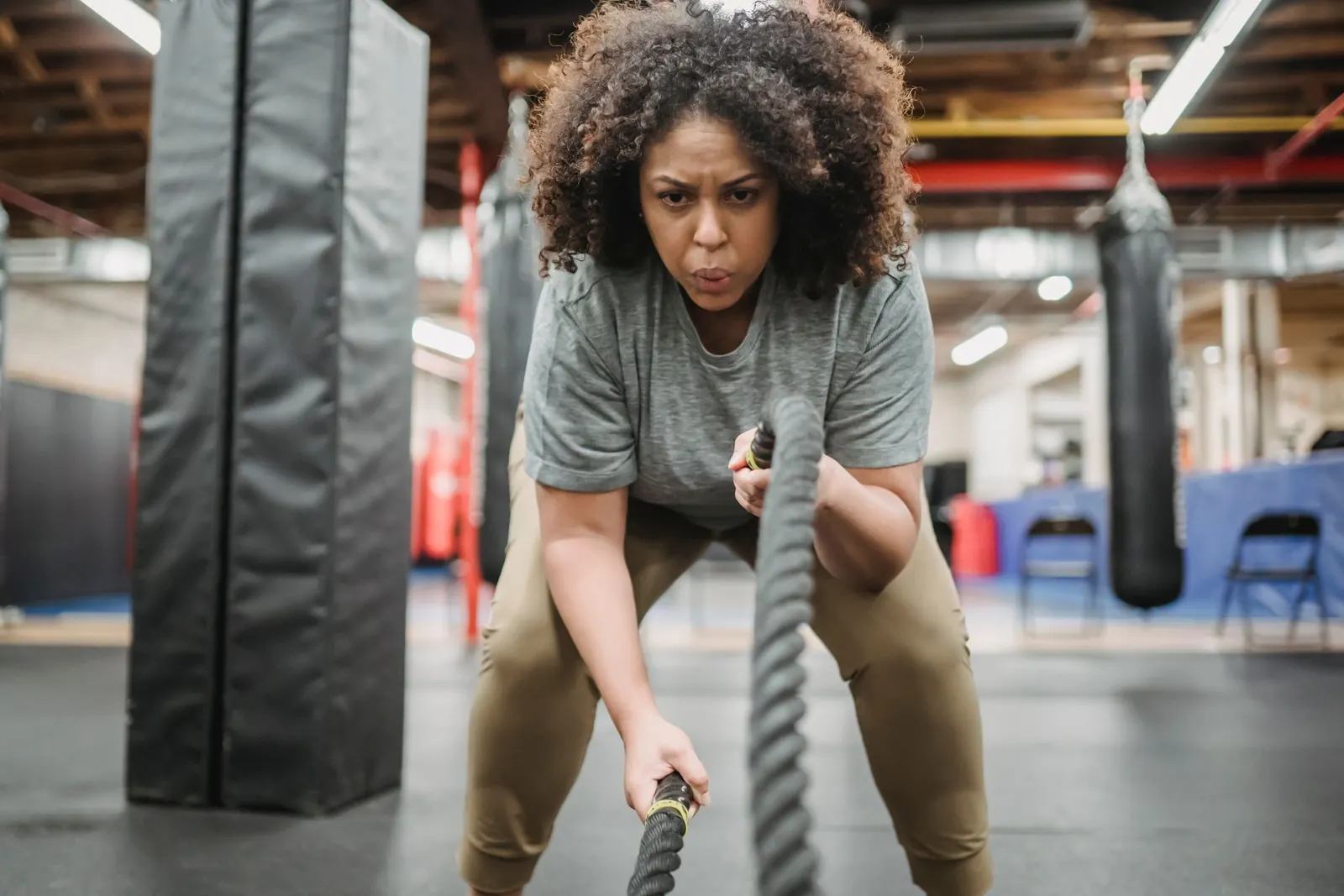 A woman training with battle ropes